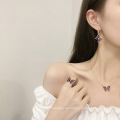 Shangjie OEM Joyas Fashion 18K Juego de joyas chapadas en oro Juego de joyas para mujeres Joya de joyería de mariposa de cristal púrpura